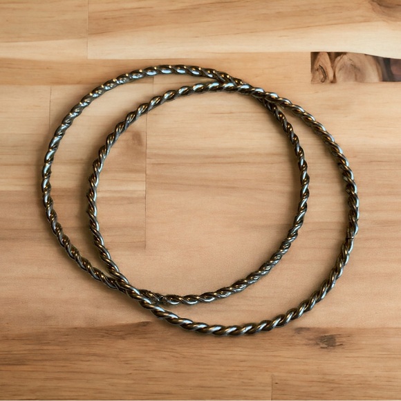 Jewelry - Two twisted gold tone bangles